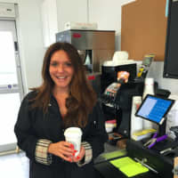<p>Owner Aegina Angeliades stands inside The Barn, her newly opened drive-through grocery store on East Main Street. The Barn is a Long Island, N.Y., institution and Stamford is the first location outside of Long Island.</p>