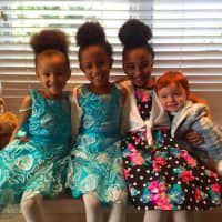 <p>Riley, Gabby and Reagan Capello of Danbury take a picture with their cousin, Chase.</p>