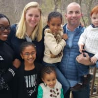 <p>Amy Stellwagen, back, second from left, and her husband, Jon, of Mamaroneck, with their son, Chase (right) will oversee the care of Gabby, Reagan and Riley along with Tethra Wallace (back row, left).</p>