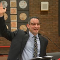 <p>Dr. Christopher Manno, who has been named Bedford Central&#x27;s new schools superintendent, address the crowd. He is pictured raising his hand while asking a question from the audience.</p>