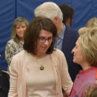 <p>Hillary Clinton speaks with Jamie Edelman, center, principal of Chappaqua&#x27;s Douglas G. Grafflin Elementary School. The building serves as Clinton&#x27;s polling place.</p>