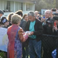 <p>Hillary Clinton signs an autograph as she meets a large crowd of supporters after casting her presidential primary ballot in Chappaqua.</p>