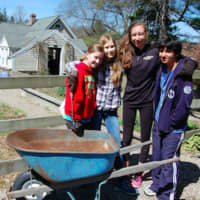 <p>Casey McCall helped clears flower beds at New Canaan Nature Center during Kyle A. Markes Day of Service April 16.</p>