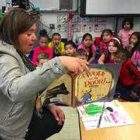 <p>Tracie Wilson, senior vice president of programming and development at NBCUniversal&#x27;s Stamford Media Center, reads to first-graders Wednesday at Toquam Magnet School. It was part of the &quot;Business to Books&quot; read-a-thon.</p>