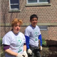 <p>Kattia Albir and Xiaorong Zhou, members of the Grade A Market Newfield Avenue Green Team, helped to spruce up Springdale Elementary School on Wednesday.</p>