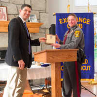 <p>Officer Mark Caswell received plaques from both the Board of Police Commissioners and the Exchange Club, as well as a proclamation from the Town of Ridgefield.</p>