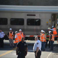 <p>Investigators at the scene at the train crossing where the collision occurred Wednesday afternoon in Bedford Hills.</p>