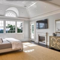 <p>The home has seven bedrooms, including a master suite with a fireplace.</p>