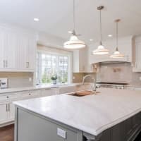 <p>The home includes 14 rooms, including a state-of-the-art kitchen.</p>