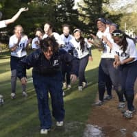 <p>The Pace softball team gives head coach Claudia Stabile a victory shower after clinching the NE-10 Conference Championship.</p>