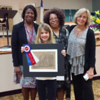 <p>Ashleigh Maura is awarded Best in Show for grades 2-4.</p>