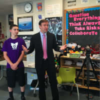 <p>U.S. Sen., Chris Murphy, D-Conn., speaks at New Fairfield Middle School about the Wingman program. Beside him is student Tyler Lent, one of the participants in the program that encourages dialogue and respect among students.</p>