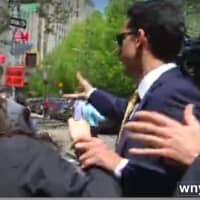 <p>A video by News Channel 13/WNYT in Albany appears to show Billy Skelos grab the wrist of a New York Daily News reporter and throw her cell phone across the street outside the courthouse in Manhattan.</p>