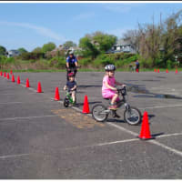 <p>Children got to ride their bikes at the Bicycle Safety Rodeo.</p>