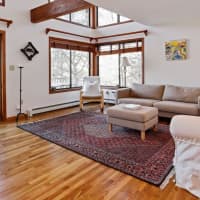 <p>The contemporary home offers lots of natural light and gleaming hardwood floors.</p>