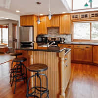 <p>The gourmet kitchen features a center island, granite countertops, stainless steel appliances and a walk-in pantry.</p>