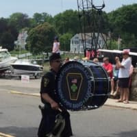 <p>Norwalk Police Emerald Society Pipe and Drum steps off in the Memorial Day Parade on Sunday in Rowayton.</p>