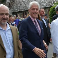 <p>New Castle Supervisor Rob Greenstein (left), marches with former President Bill Clinton in the town of New Castle&#x27;s annual Memorial Day parade, which went through downtown Chappaqua.</p>