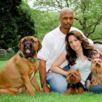 <p>Eddy and Elyssa Guerrier with their three dogs.</p>