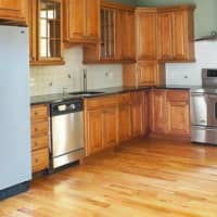 <p>The home includes a huge kitchen with stainless steel appliances, granite countertops and quality cabinetry.</p>