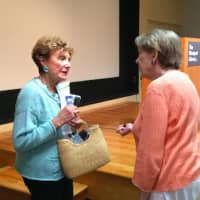 <p>Publishers Weekly Contributing Editor Sybil Steinberg chats with a fellow book lover after revealing her list of summer reads Friday at Westport Library.</p>
