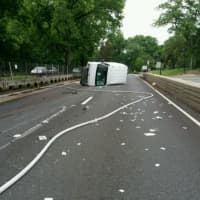 <p>An overturned vehicle closed down the Merritt Parkway near the rest area in Greenwich on Saturday evening.</p>