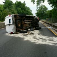 <p>An overturned vehicle closed down the Merritt Parkway near the rest area in Greenwich early Saturday evening.</p>