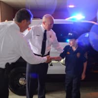 <p>Everette Negrin is greeted by Teaneck officials before starting his day as &quot;chief.&quot;</p>