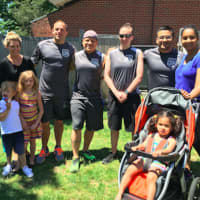 <p>The third place Darien Police Department team with their families.</p>
