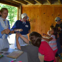 <p>Children learn what life was like in Colonial Times in Sherman Historical Society program</p>