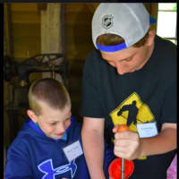 <p>At the Sherman Historical Society, children learn how to make toys from wood.</p>