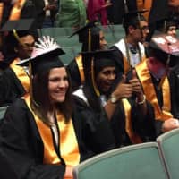 <p>Anika Chatterjee, of Norwalk, gives a &quot;thumbs up&quot; to a friend at AITE&#x27;s graduation Tuesday. At left is Maggie Carucci, of Stamford. Chatterjee will attend University of Wisconsin at Madison while Carucci will attend Pace University in NYC.</p>