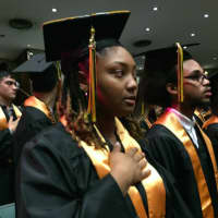 <p>Mekkah Gathers, of Bridgeport, recites the Pledge of Allegiance at the opening of AITE&#x27;s graduation ceremony Tuesday. She will be attending Valley Dental School.</p>