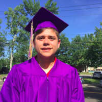 <p>Jason Najera, before the graduation ceremony Wednesday at Westhill High School. He plans on attending UCONN Stamford.</p>