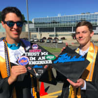 <p>Garrett Daly, left, and Colin Perry, right, both of Stamford show their mortarboards that they designed prior to the AITE graduation ceremony. Perry&#x27;s has &quot;The Amplidudes&quot; on it, the name of the company he, Daly and Dan Trapp created.</p>