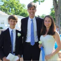 <p>Head of Upper School Tim Delehaunty is flanked by Turner Ives of New Canaan who presented the Class Reflection and Susanna Montgomery also of New Canaan who delivered the Class Salutation at New Canaan Country School’s 100th Closing Exercises.</p>