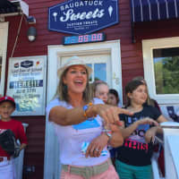 <p>Dr. Rebecca Timlin-Scalera of Fairfield points out a participant in a charity ice cream event in Fairfield Friday that raised money for breast cancer research.</p>