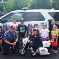 <p>Saddle Brook police officer Christopher Stanton surprised Andrew, 4, at his police-themed birthday party</p>