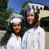 <p>Daisy Rozario, left, who will attend Western Connecticut State University and Carolyn Vaum, right, who will attend Central Connecticut State University, posing together before the Wilton High School graduation ceremony.</p>