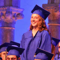 <p>A member of North Salem High School&#x27;s Class of 2016 stands during an acknowledgement ceremony for scholarship and award recipients.</p>