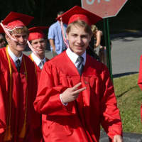 <p>Somers High School 2016 graduates march to their commencement.</p>