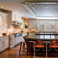 <p>The renovated kitchen is one of the centerpieces of the home at 11 Hedgerow Lane.</p>