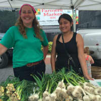 <p>Willow Schultz, left, of Clatter Valley Farm in New Milford and employee Jennifer Gutaman at the Danbury Farmers Market on Saturday. The market opened Saturday and runs until Oct. 22.</p>
