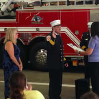 <p>Wilton Town Clerk Lori Kaback, right, swears in Wilton Fire Department&#x27;s new Deputy Fire Marshal Kevin Plank. At left is Plank&#x27;s wife, Gale.</p>