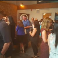<p>A large crown gathers at the new Kennedy Flats apartments in Danbury for a CityCenter mixer.</p>