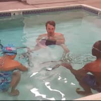 <p>Brookfield resident Joseph Buderwitz teaches a beginning swim class for adults at the Dive Shop.</p>