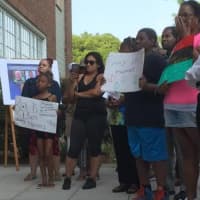 <p>People gather at Norwalk City Hall in response to the shooting of two black men by police and for the deaths of five Dallas police officers.</p>