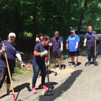 <p>About 30 staff members from PKF O&#x27;Connor Davies accounting and advisory firm from Stamford and Wethersfield participate in a day of community service recently at Camp Candlewood in New Fairfield.</p>