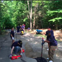 <p>Tasks the team worked on include sealing cracks, repairing asphalt and making improvements to the camp roadway.</p>