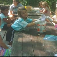 <p>Girls make tie-dye shirts at Camp Aspetuck in Weston.</p>